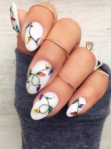 luzes de natal em unhas